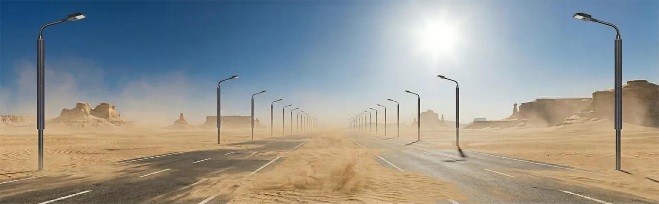 Self-cleaning pole with vertical solar panel showing no dust or sand accumulation on a desert highway..webp