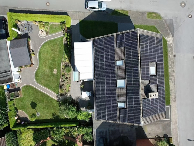 Aerial view of residential rooftop solar panel installation