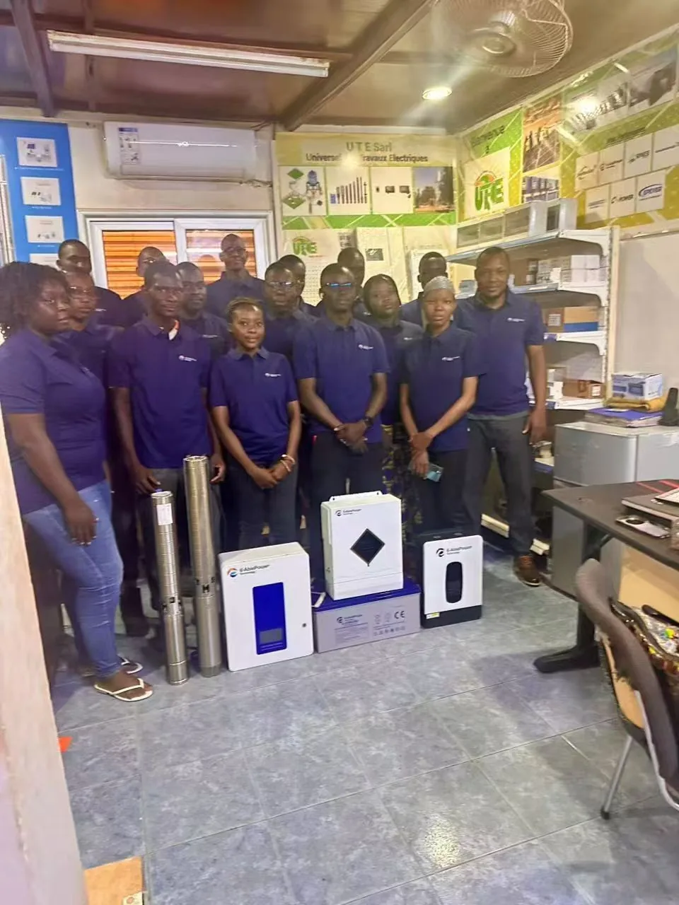 UTE partner team with E-Able Power solar equipment displayed in their retail store