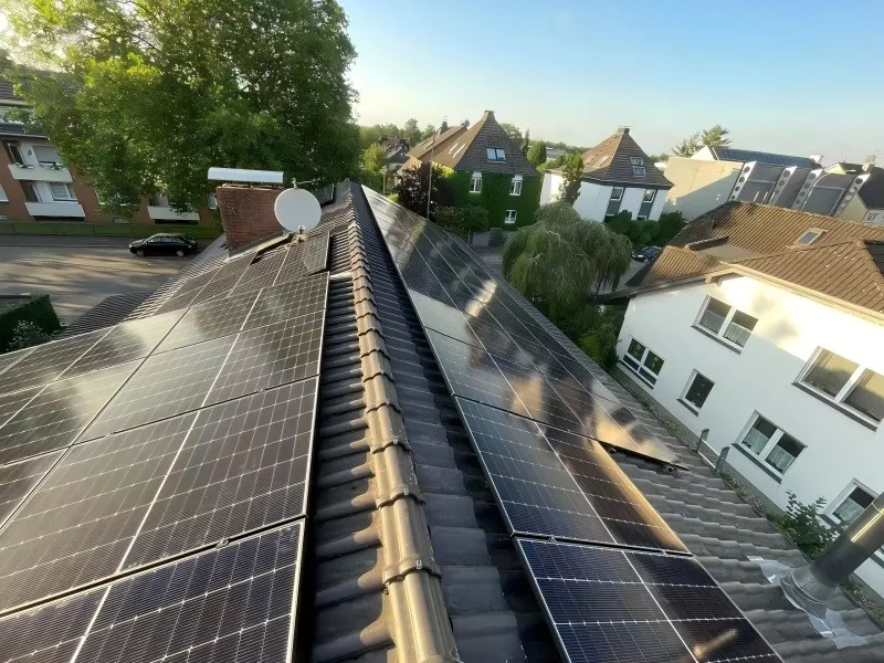 Close view of a residential rooftop solar panel array installation